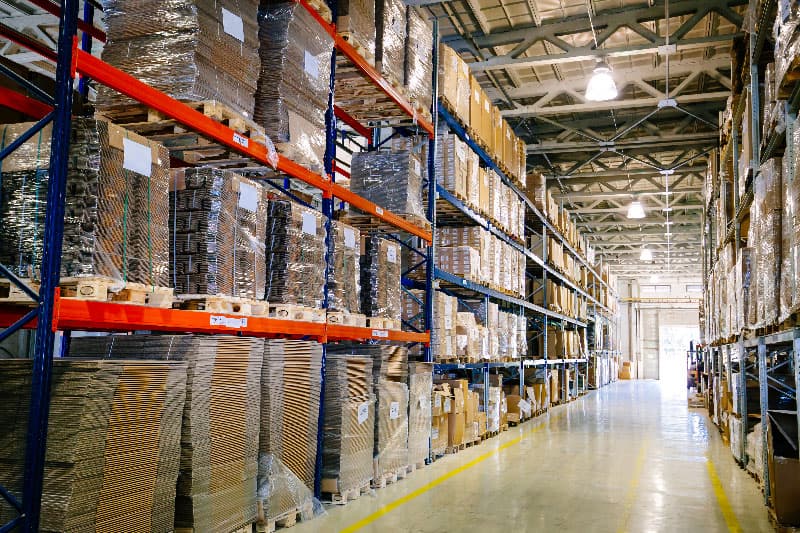 Interior of a modern warehouse with stacked pallets